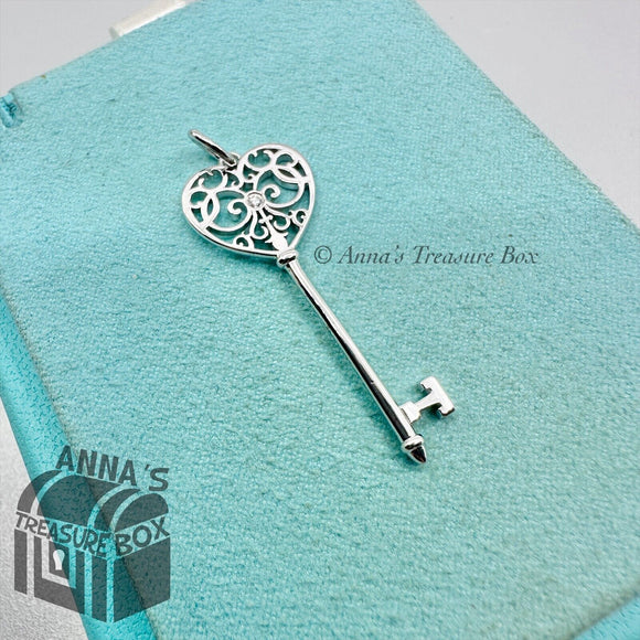 Tiffany & Co. 18K White Gold with Diamond Enchant Key Charm (box, pouch, ribbon)